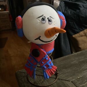 Whimsical Snowman Figurine with Blue and Red Accents